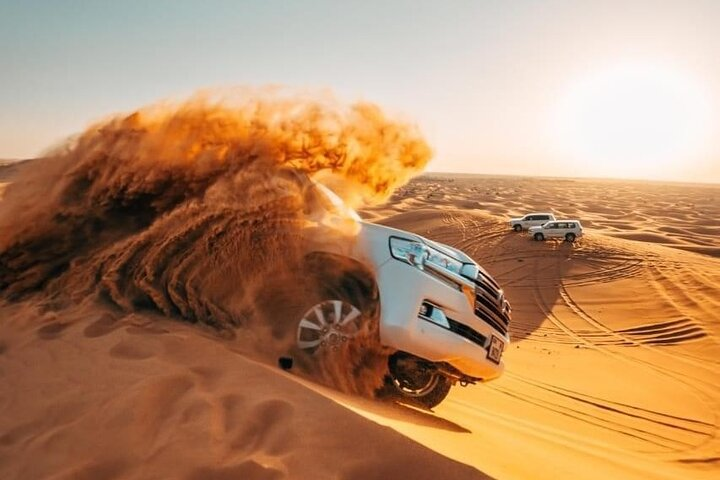 Experience the magic of a sunrise over golden dunes slide down with exhilarating sandboarding and feel the rush of dune-bashing in Dubai’s stunning Lahbab Desert.